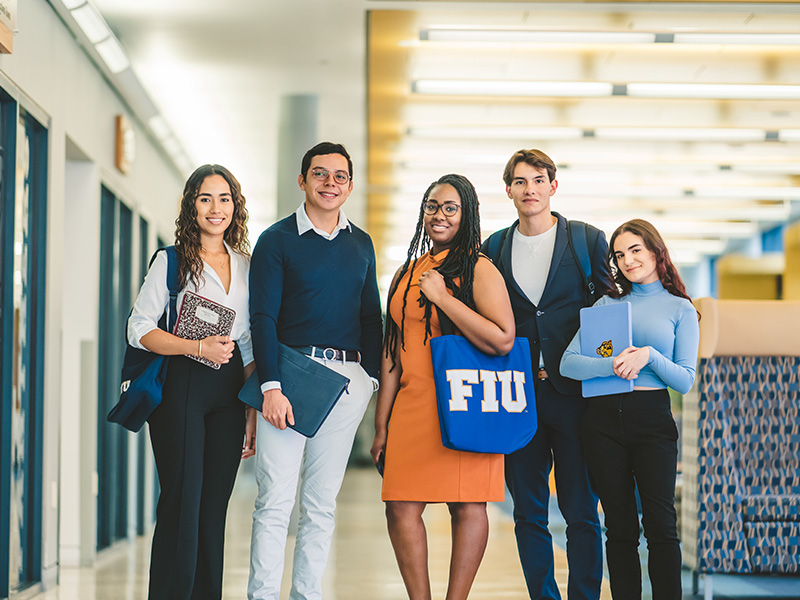 Five FIU students posing together